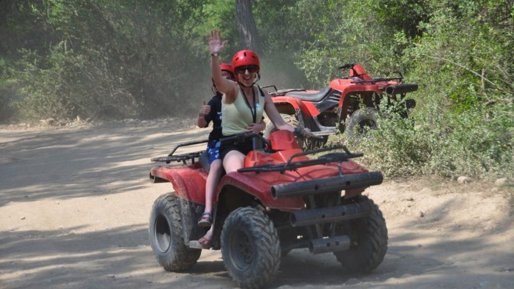 Antalya quad safari rider on dusty forest trail with safety helmet on combo adventure tour