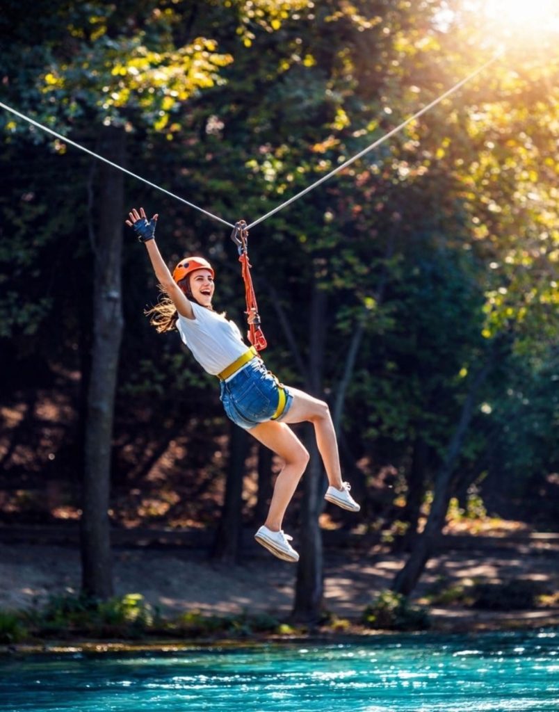 Zipline over turquoise river in golden sunset light at Koprulu Canyon Antalya