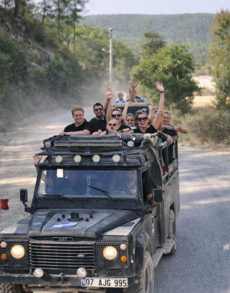 Jeep safari convoy on dusty Taurus Mountain road during Antalya Tazi Canyon Jeep Safari and Rafting Tour