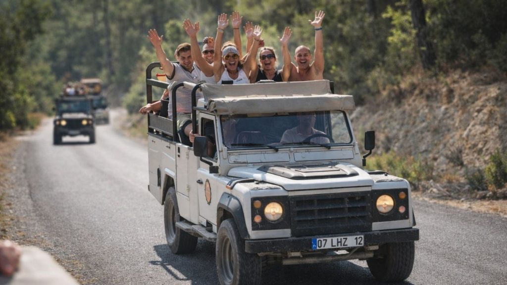 Open top jeep safari convoy on Taurus Mountain road during Antalya Tazi Canyon Jeep Safari and Rafting Tour