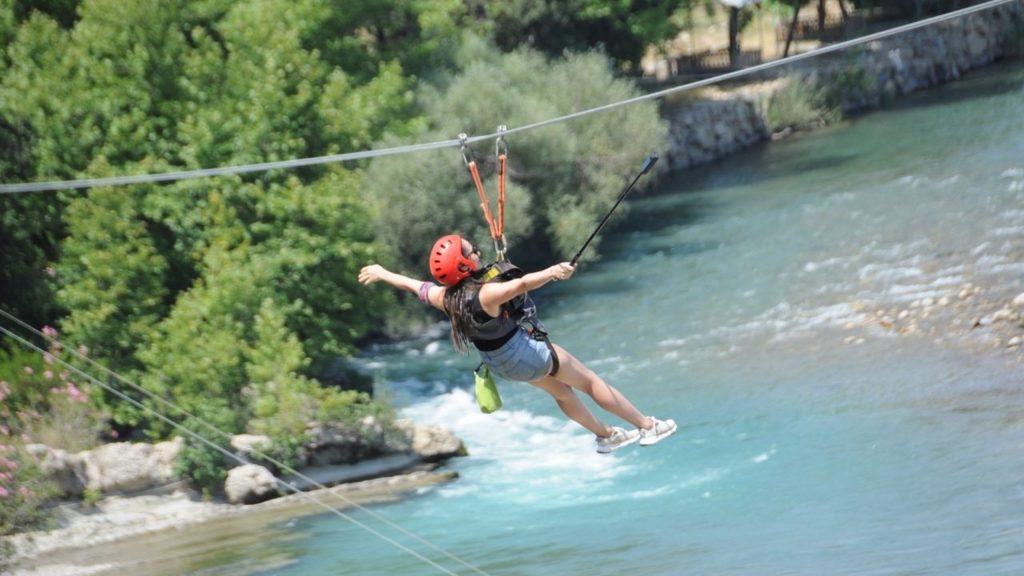 Zipline over turquoise Koprulu Canyon river during Antalya Tazi Canyon Jeep Safari Zipline and Rafting Tour