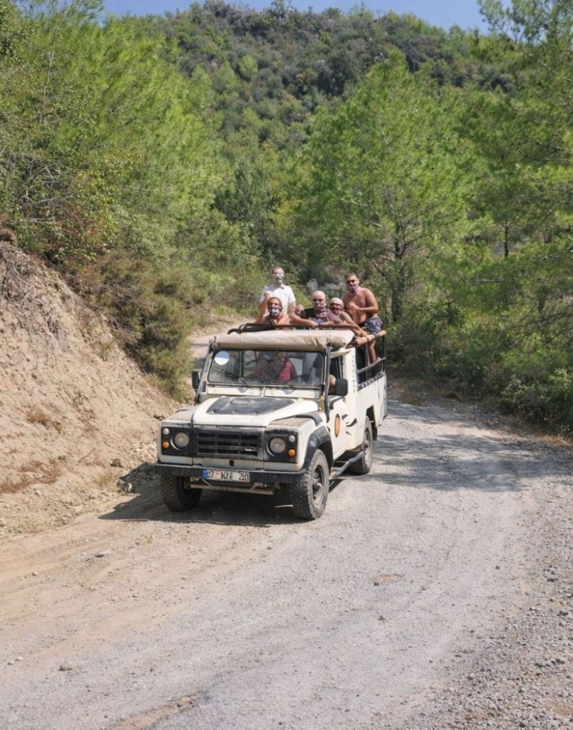 Jeep safari on dusty Taurus Mountain road during Antalya Tazi Canyon Jeep Safari Zipline and Rafting Tour